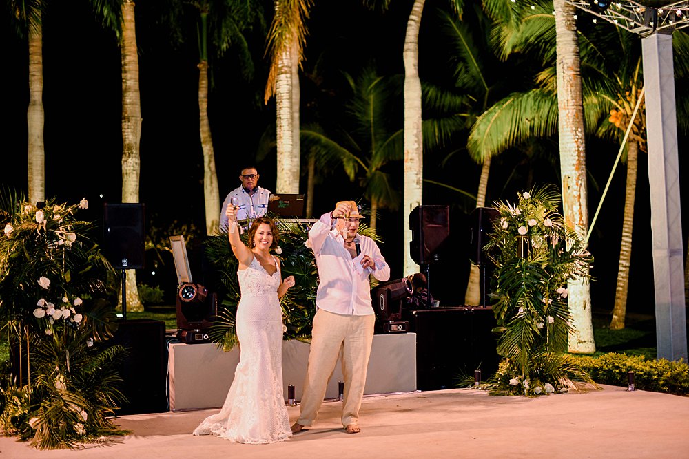 bride and groom toasting in destination casa de campo wedding