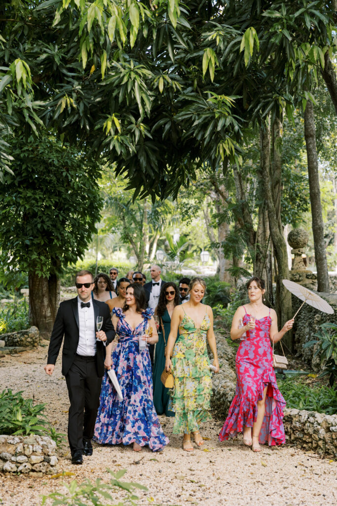 wedding guests arriving at garden ceremony