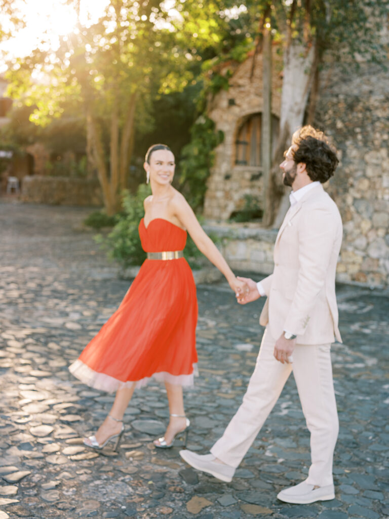 bride with oscar de la renta red dress